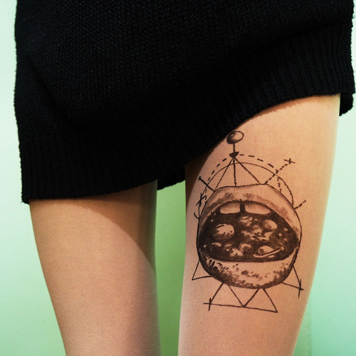 Tattoo tights with a unique design create the illusion of leg ink under a black dress.