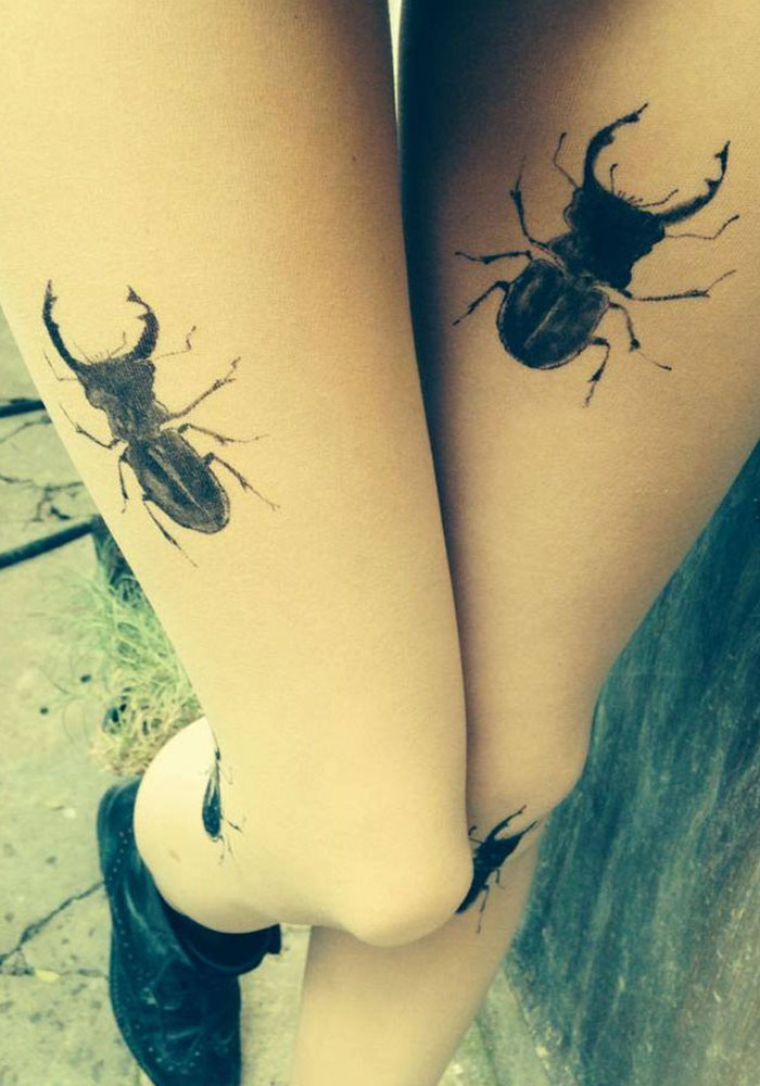 Tattoo tights with beetle designs create an illusion of inked legs.