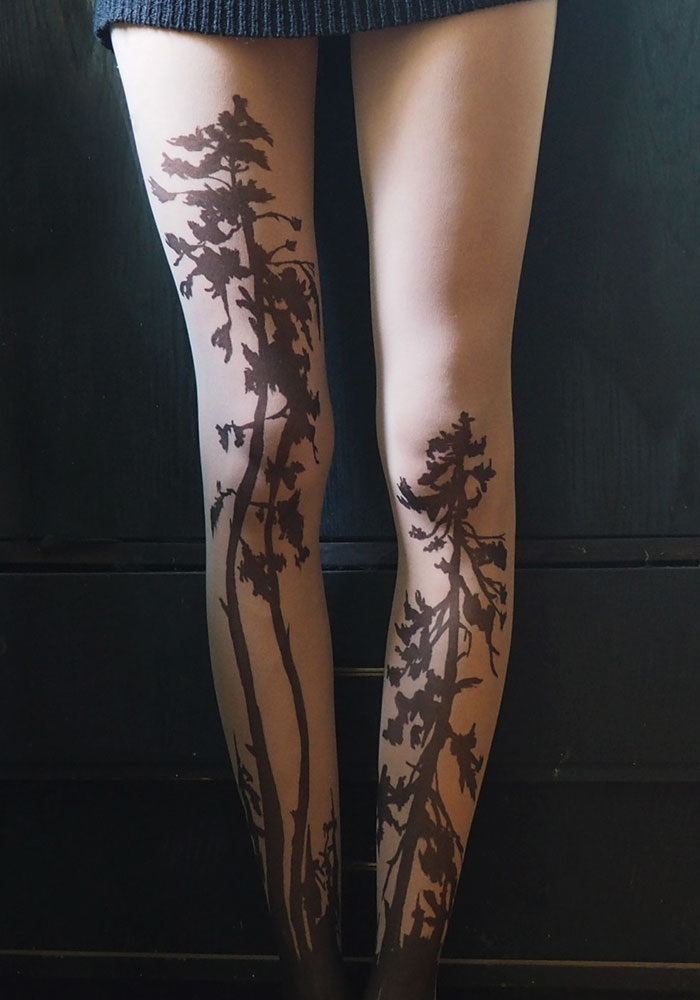 Tattoo tights with tree designs create an inked illusion on legs.