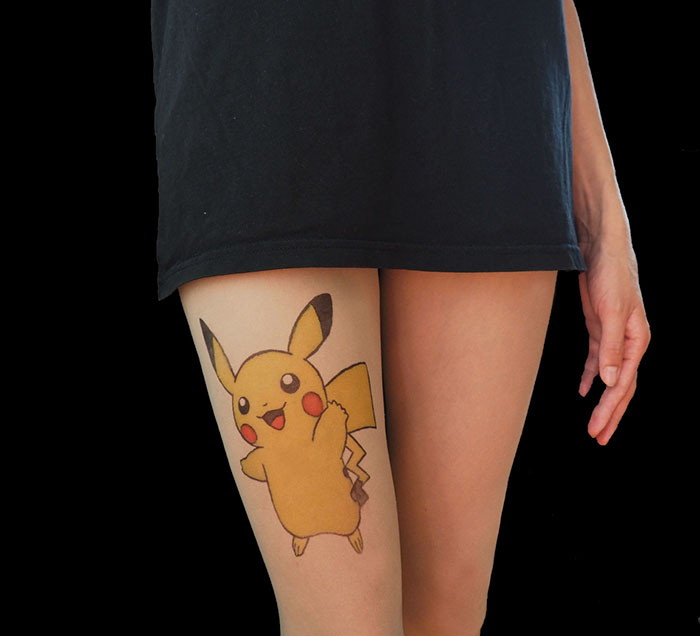 Person wearing tattoo tights featuring Pikachu design, creating an inked illusion on the leg.