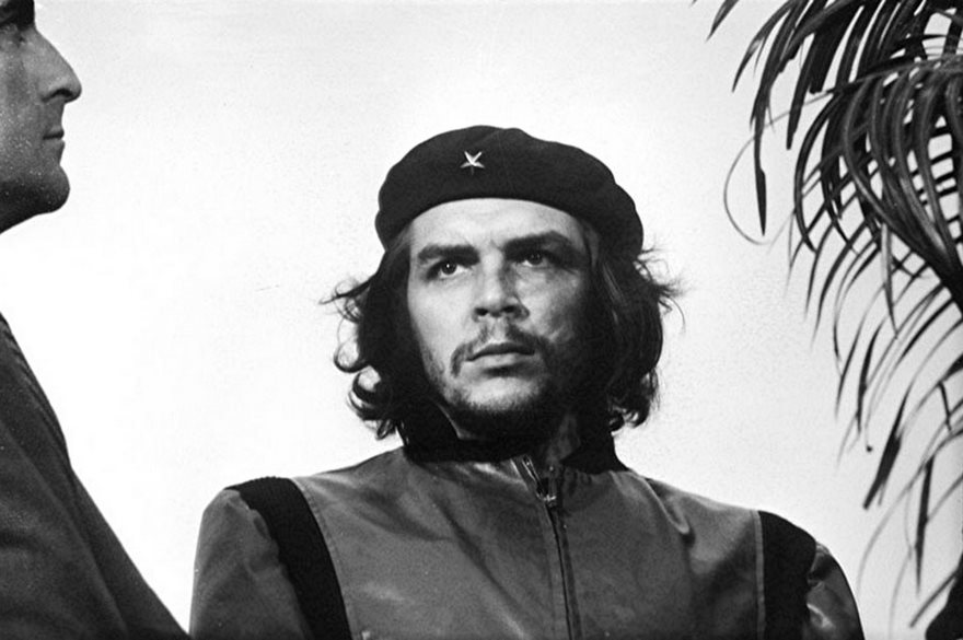 A man in a beret and leather jacket, part of famous historical photo collection.