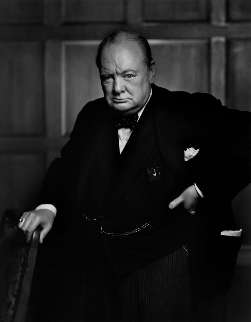 Portrait of a historical figure in a suit, considered among the most famous photos in history.