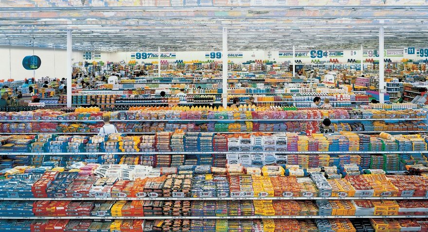 Vast supermarket aisle packed with colorful products, showcasing the variety and abundance typical of famous photos.