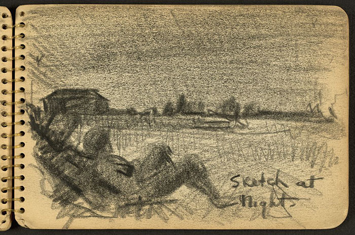 Soldier Sitting On Ground At Night While Stationed At Fort Jackson, South Carolina