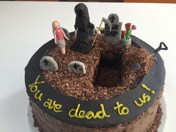 Farewell cake decorated with a graveyard theme and the humorous message "You are dead to us!" written on top.