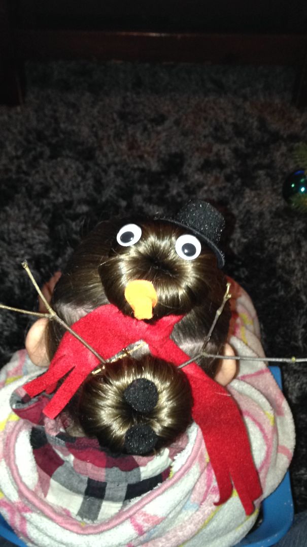 Creative Christmas hairstyle styled as a snowman with stick arms and scarf.