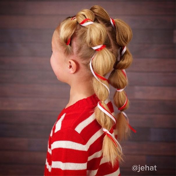 Creative Christmas hairstyle featuring braided ponytail with red and white ribbons, perfect for festive celebrations.