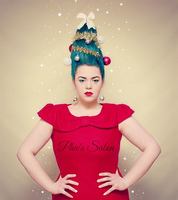 Creative Christmas hairstyle featuring tree-shaped blue hair adorned with ornaments and tinsel.