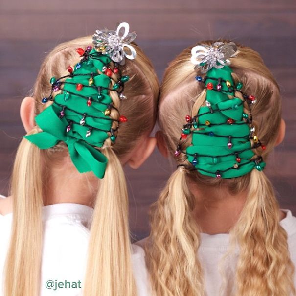 Creative Christmas hairstyles on two girls, styled as festive trees with green ribbons and colorful lights.