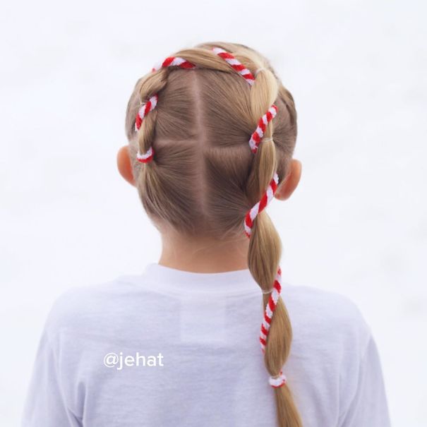 Creative Christmas hairstyle with candy cane braided ribbon, viewed from behind.