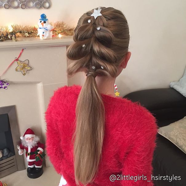 Creative Christmas hairstyle featuring star and gem decorations on long brown hair.