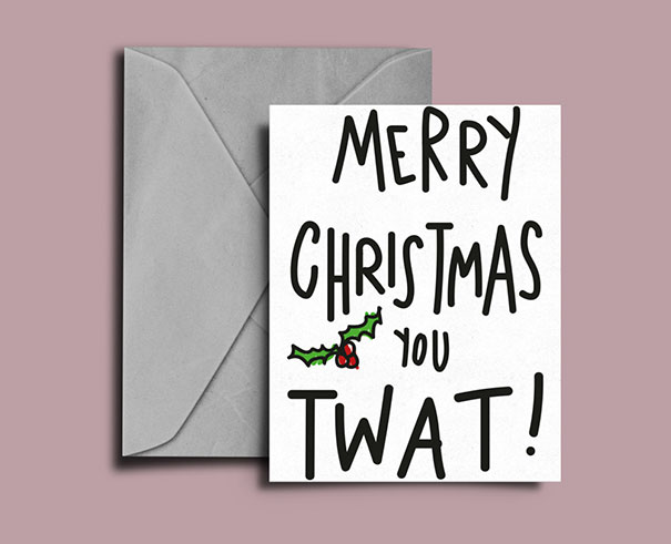 Rude Christmas card with envelope, featuring humorous text: "Merry Christmas You T**t!" on pink background.