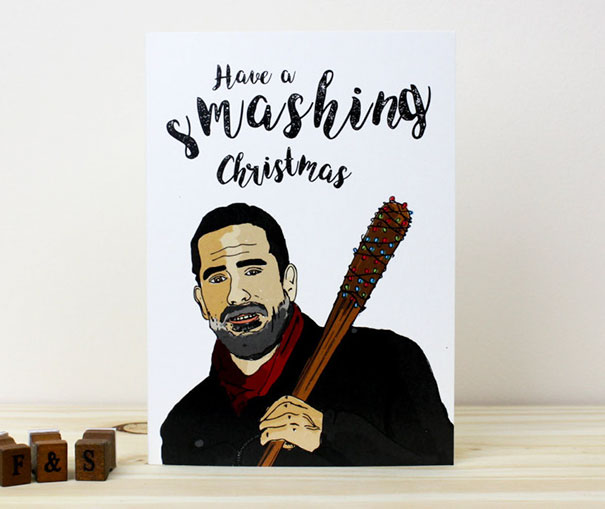 Rude Christmas card featuring a man with a bat, captioned "Have a smashing Christmas" for twisted humor.