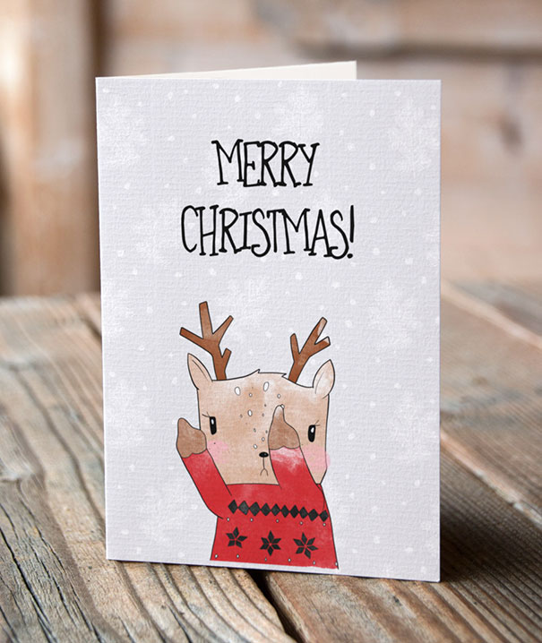 Rude Christmas card with a reindeer in a red sweater making a cheeky gesture.