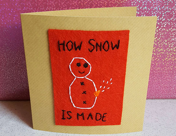 Rude Christmas card with a comical snowman on red felt, showing a quirky twist on snow creation humor.