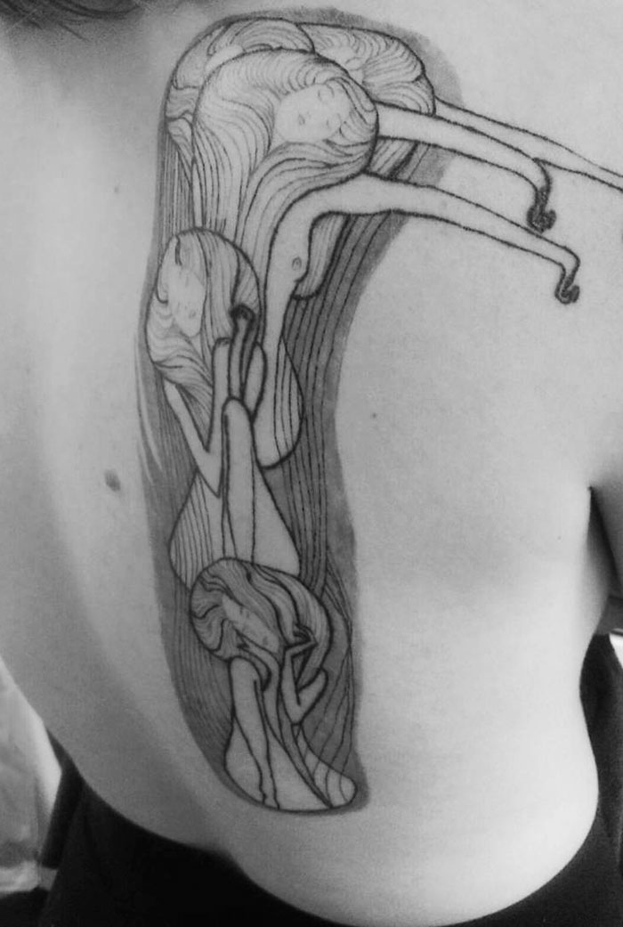 Black and white Gustav Klimt tattoo design on a person's back.