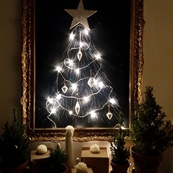 Framed Christmas tree with lights to protect from cats and dogs.