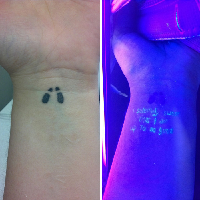 Subtle Harry Potter tattoo of footprints and hidden Marauder's Map quote under UV light.