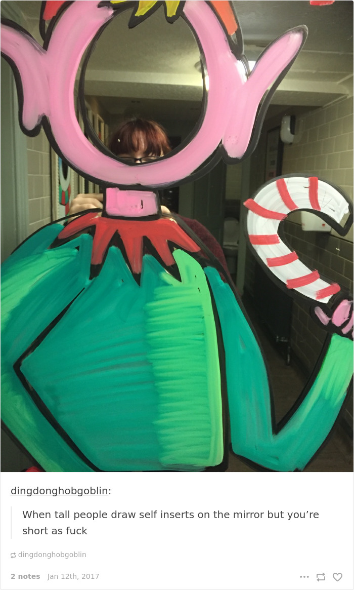 Short person peeking over a mirror drawing of a tall person, highlighting common short people problems.