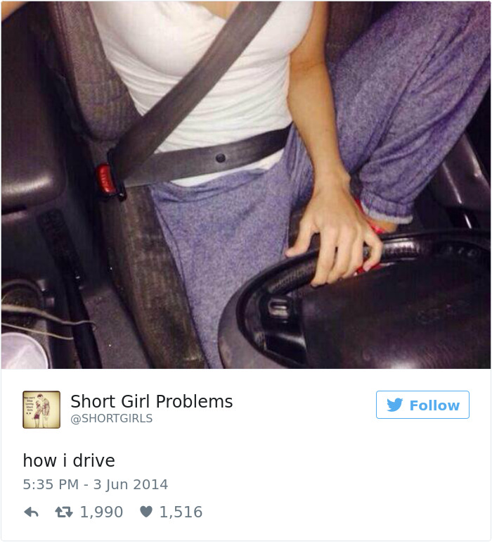 Short person driving with a knee on the seat for better reach, illustrating common short people problems.