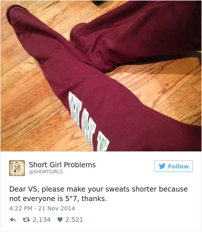 Maroon sweatpants with message highlighting short people problems, humorously requesting shorter length for better fit.