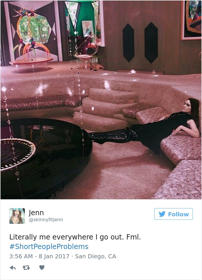 Person in a modern room struggling with short people problems, lounging on a step that’s too high to climb comfortably.