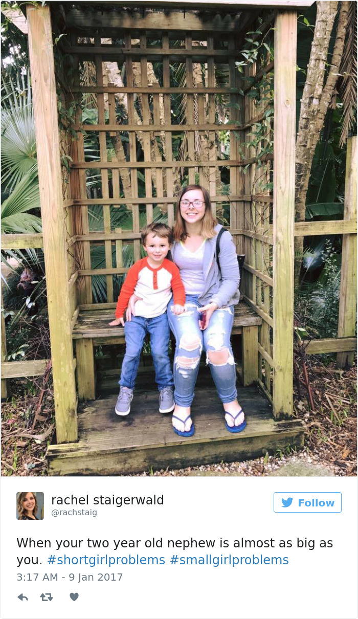 Woman sitting with nephew, both smiling in a garden, highlighting short people problems and small girl struggles.