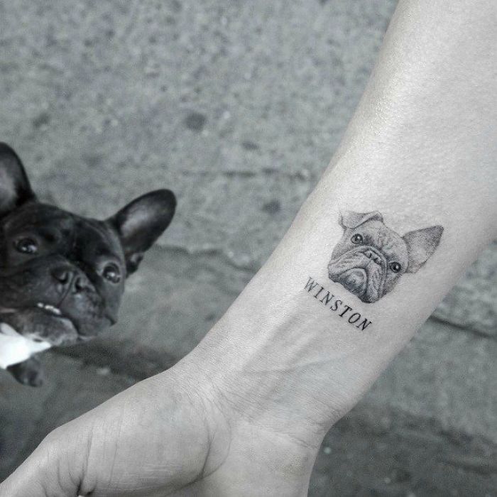 Dog tattoo idea featuring a French Bulldog design with the name "Winston" on a person's wrist.
