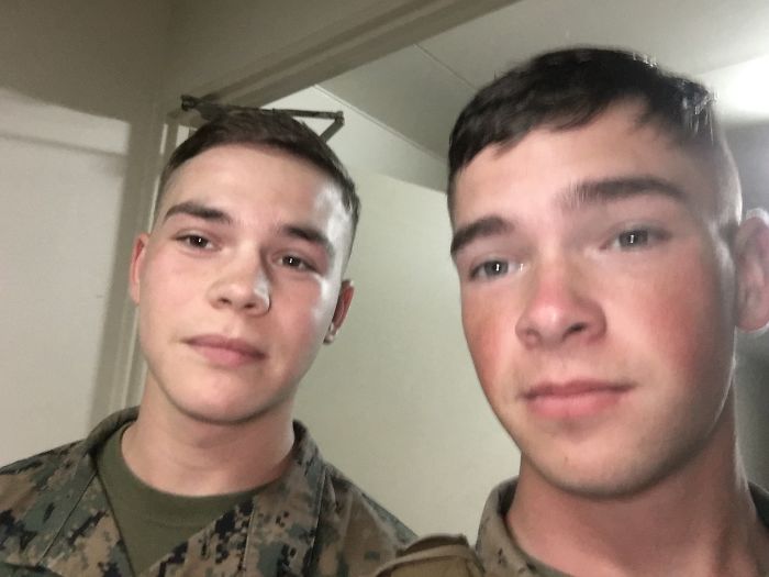 Two doppelgangers taking a selfie in a military uniform 