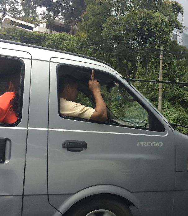 This Guy Giving Everyone The Finger Without Noticing