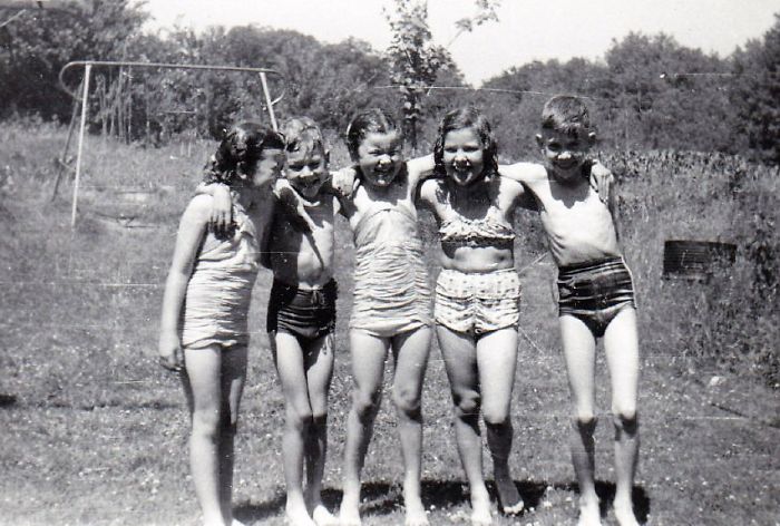 Summer Fun In The Sprinkler ..about 1950