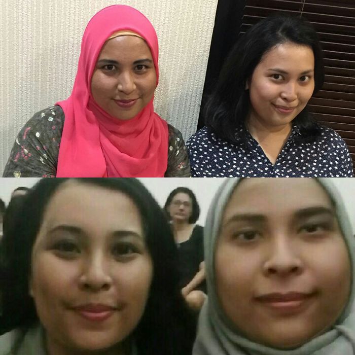 Two doppelgangers smiling and posing near a wall 