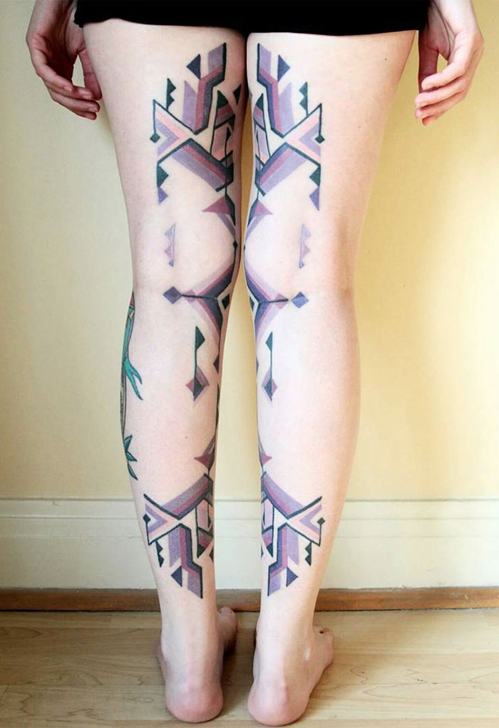 Amazonian tribal art tattoo designs on legs, inspired by Brazilian artist Brian Gomes, showcasing geometric patterns.