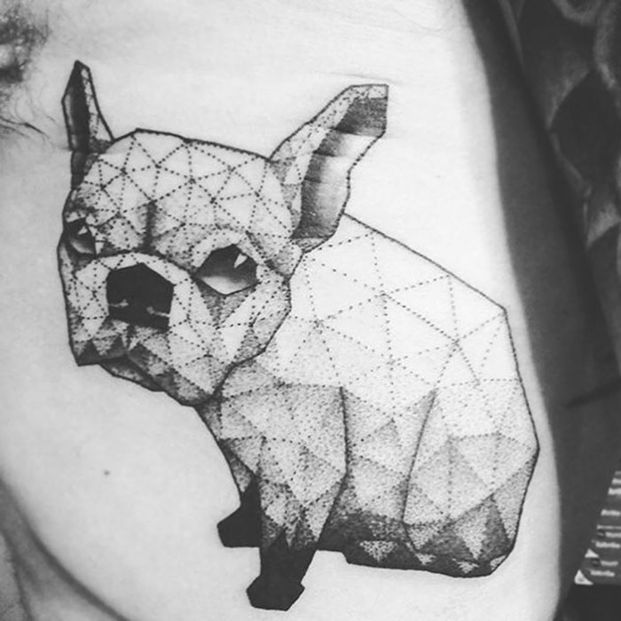 Geometric dog tattoo with intricate dotwork shading.