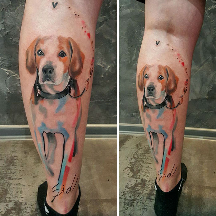 Watercolor dog tattoo design on a leg, showcasing artistic use of colors and lifelike details.