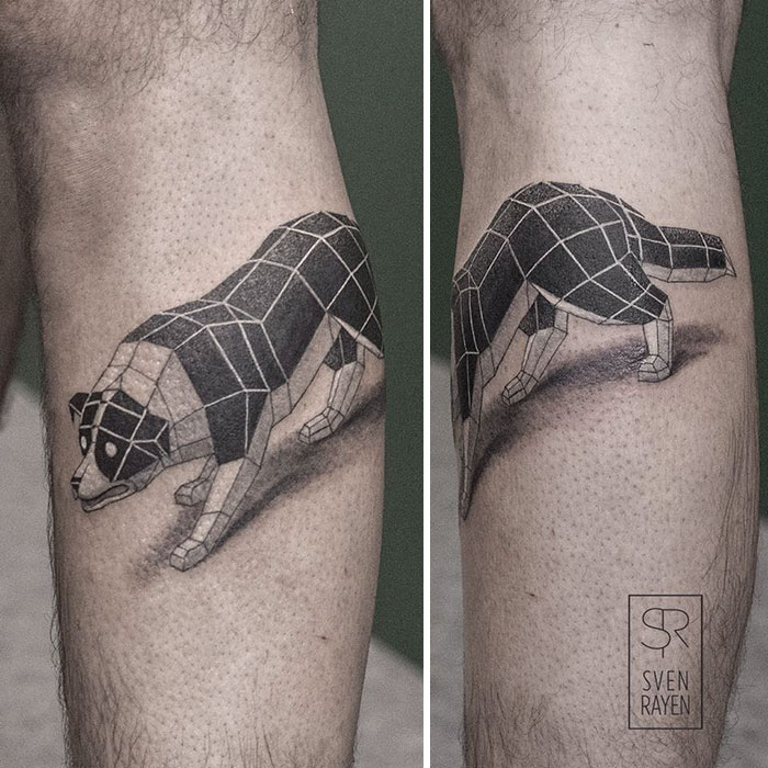Geometric dog tattoo on calf showcasing modern design and artistry.