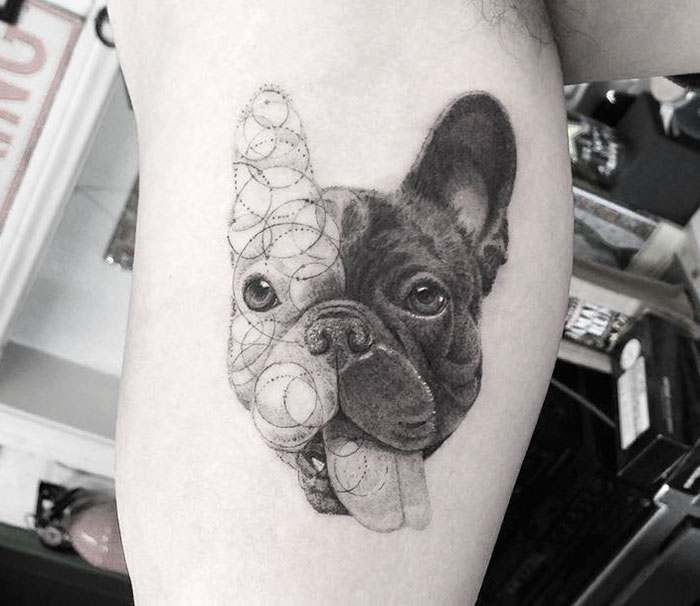 Dog tattoo art with geometric design on one side, depicting a French Bulldog's face.
