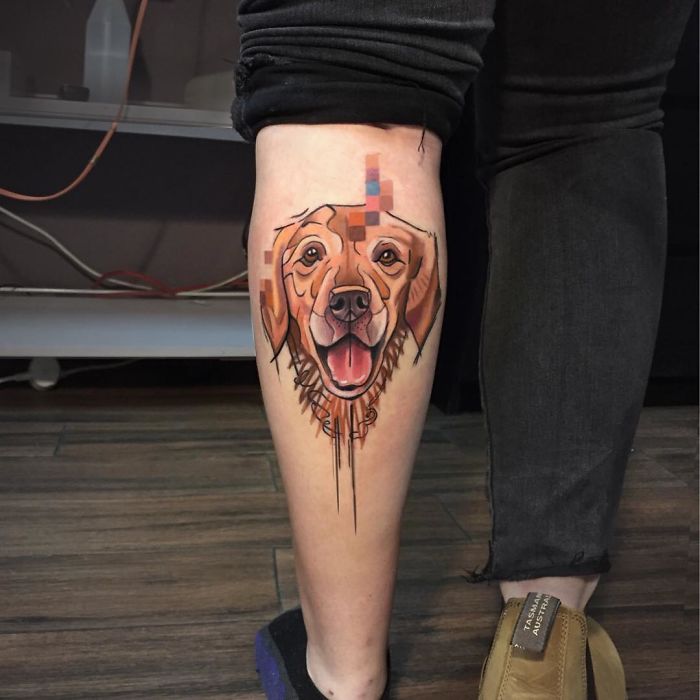 Dog tattoo design with abstract elements on a person's calf.