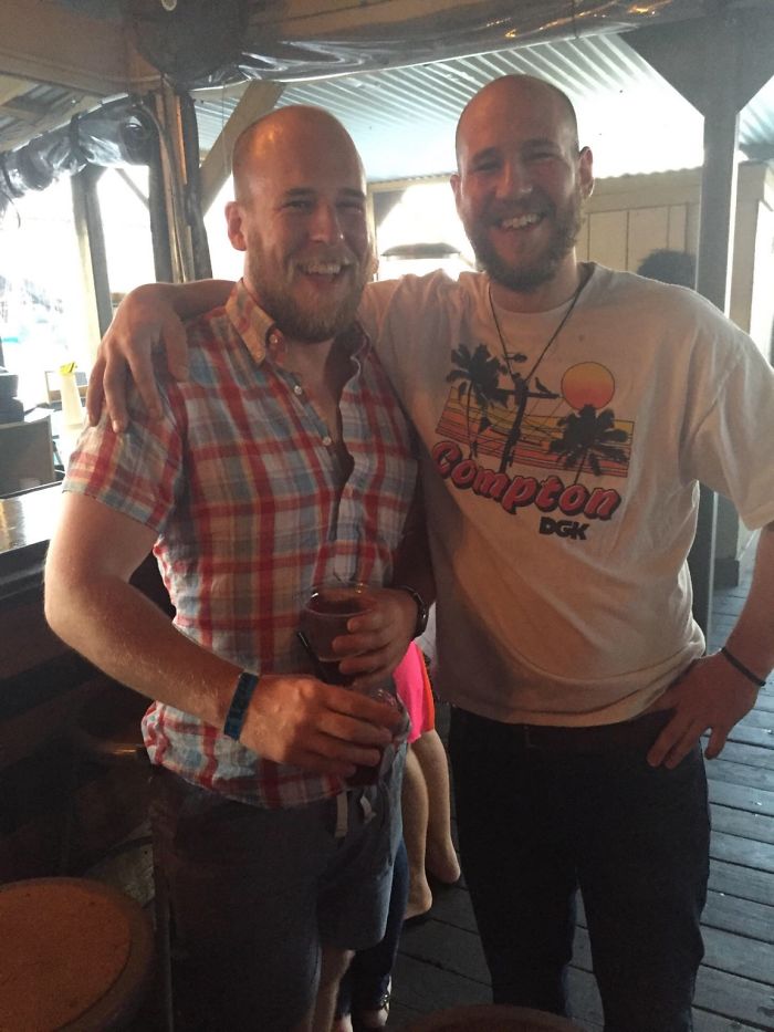 Two doppelgangers hugging in a party 