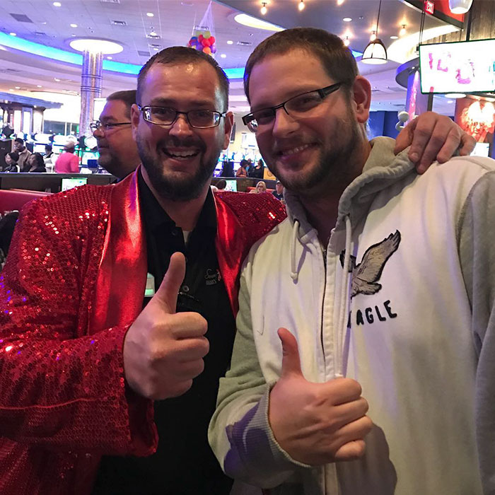 Two doppelgangers hugging at the casino 