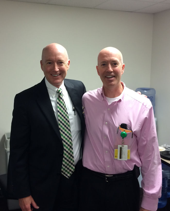 Two bald doppelgangers in the office 