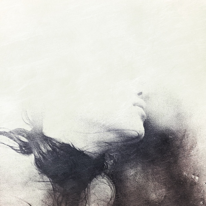 Abstract depiction of depression by an artist, featuring a blurred face blending into a textured background.