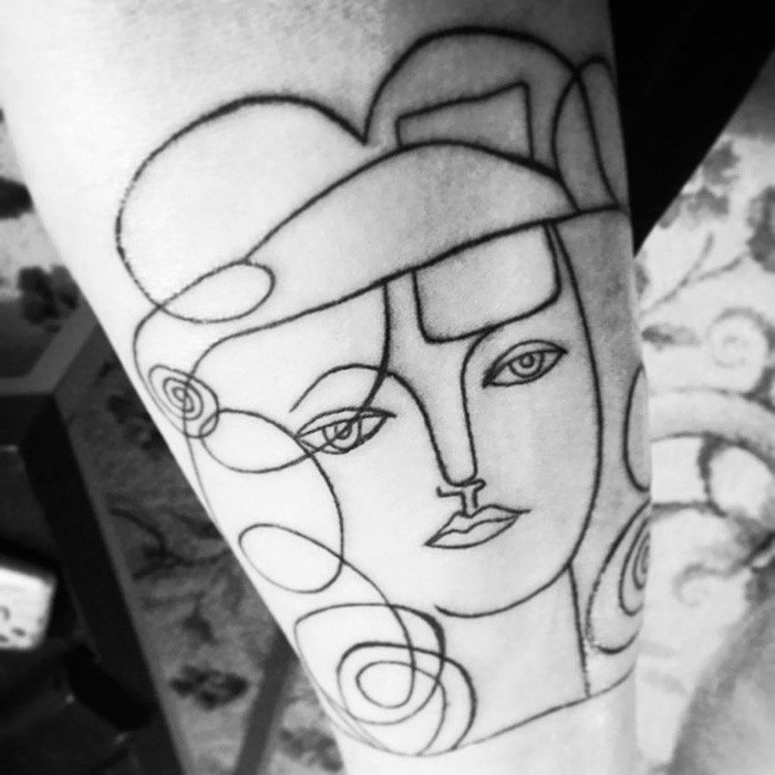 Line art tattoo inspired by classical art, featuring a stylized face with geometric shapes and flowing lines.