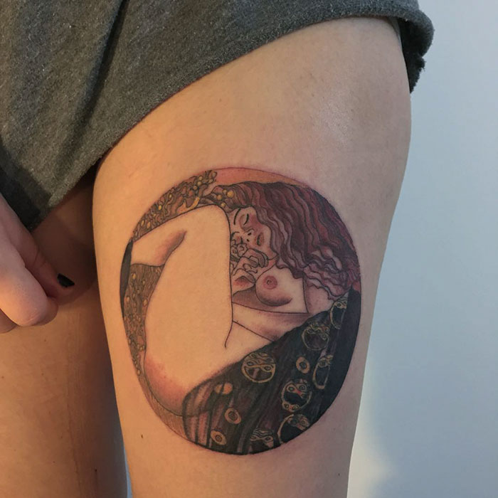 Classical art-inspired tattoo on a person's thigh, showcasing intricate details and vibrant colors.