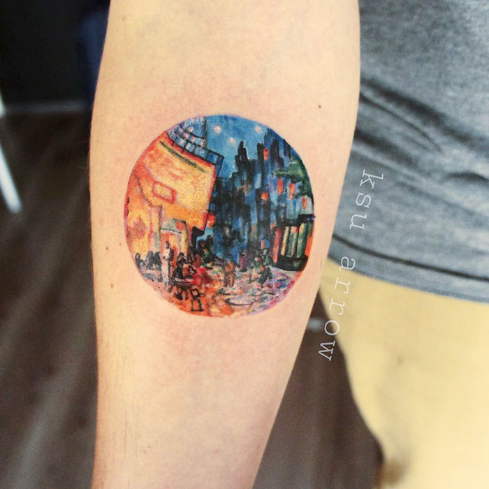 Classical art-inspired tattoo of a vibrant city scene on an arm.