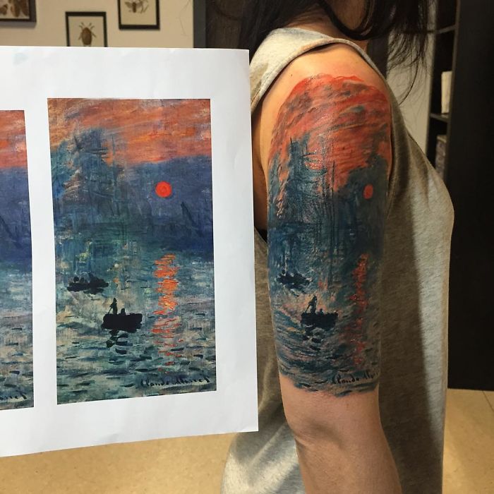 Classical art-inspired tattoo on arm, replicating a famous painting with a vibrant sunset and boats on water.