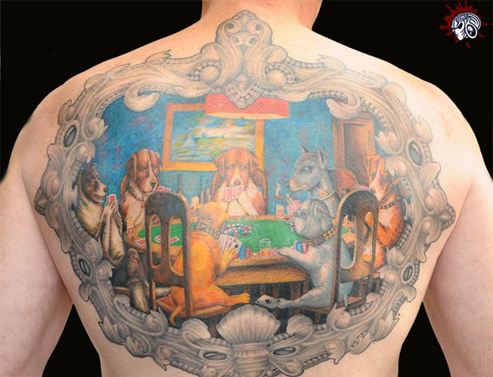 Back tattoo of classical art-inspired design featuring dogs playing poker.