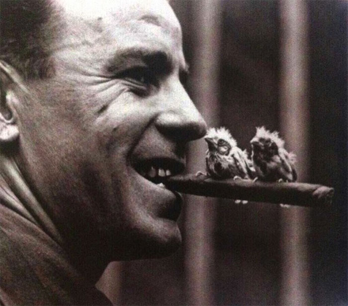 An Officer Holds A Cigar With Two Canaries Perched On It, 1918
