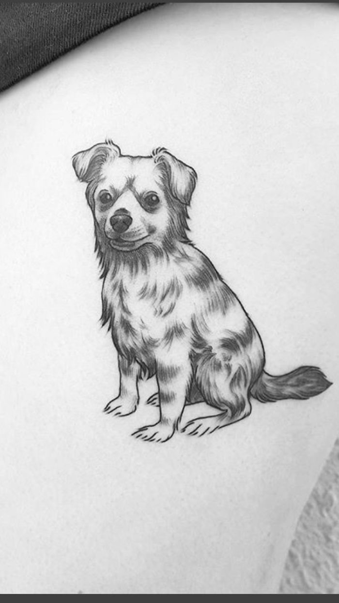 Black and white dog tattoo featuring a small, fluffy dog sitting with a friendly expression.