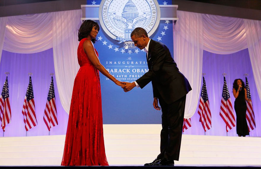 The President holding First Lady's hand 